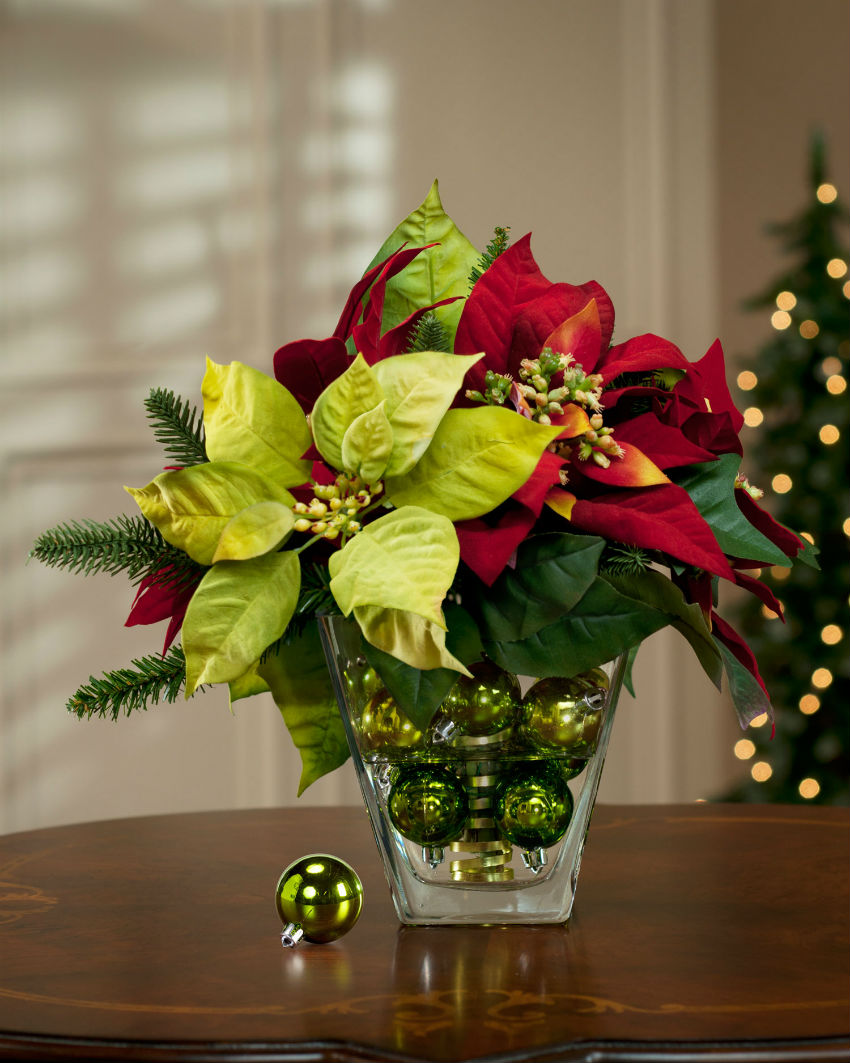 Poinsettias are a classic but you can play with them, too. Image Source: Pinterest