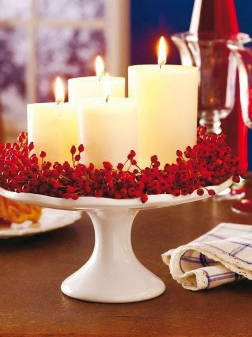 This beautiful centerpiece uses cranberries for a red touch. Image Source: Pink Lover