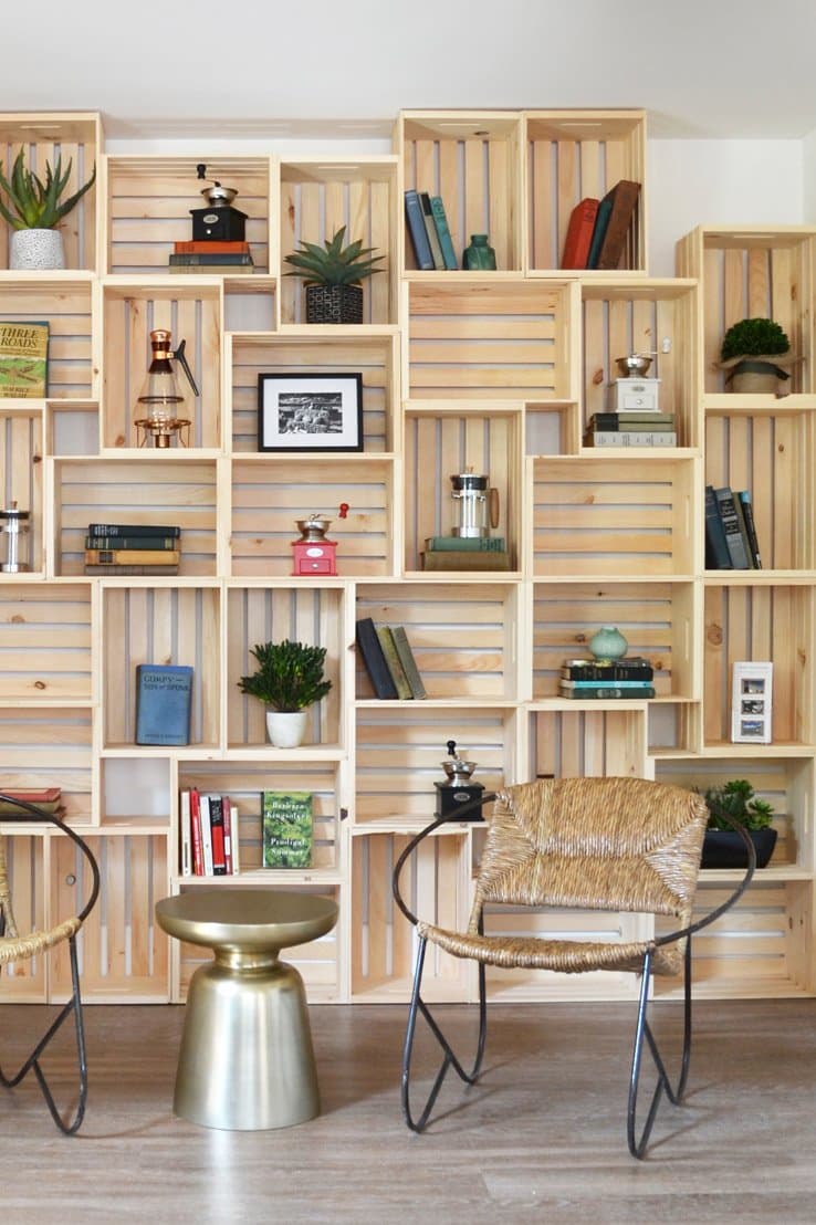 Wood crates make a beautiful wall cover with great storage potential. Via Apartment Therapy.