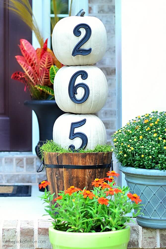 A numbered house with ornate DIY pumpkins