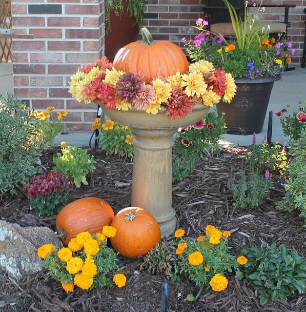 The simple act of placing a pumpkin on a fountain can be a really creative DIY project