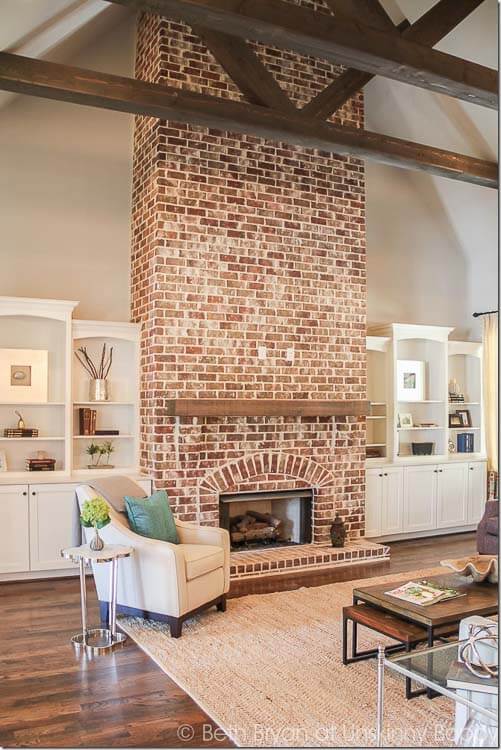 A fireplace is the perfect place to show off exposed brick.