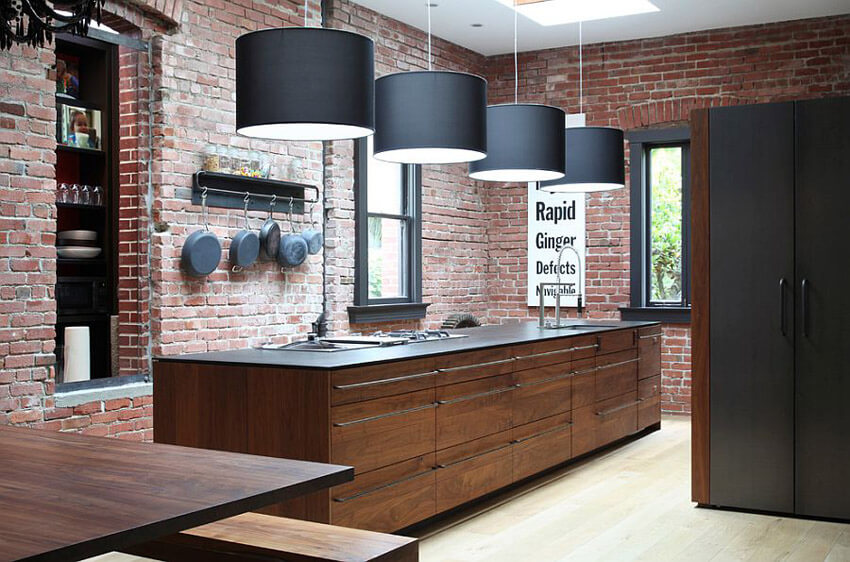 Exposed brick adds an industrial edge to the kitchen.