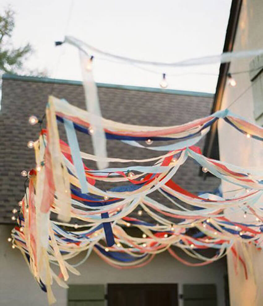 Hang streamers and lights in your backyard for Memorial Day!
