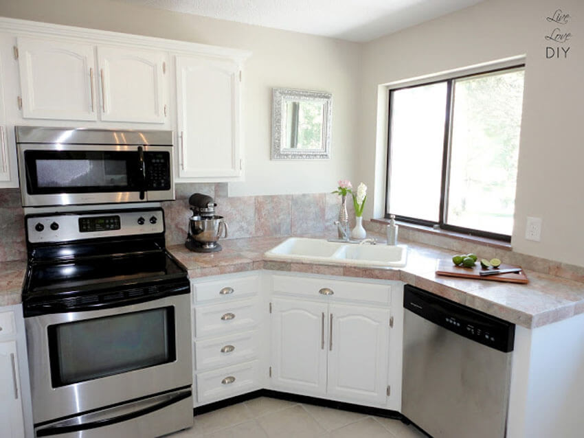 White cabinets reflect light better, making the space feel bigger.